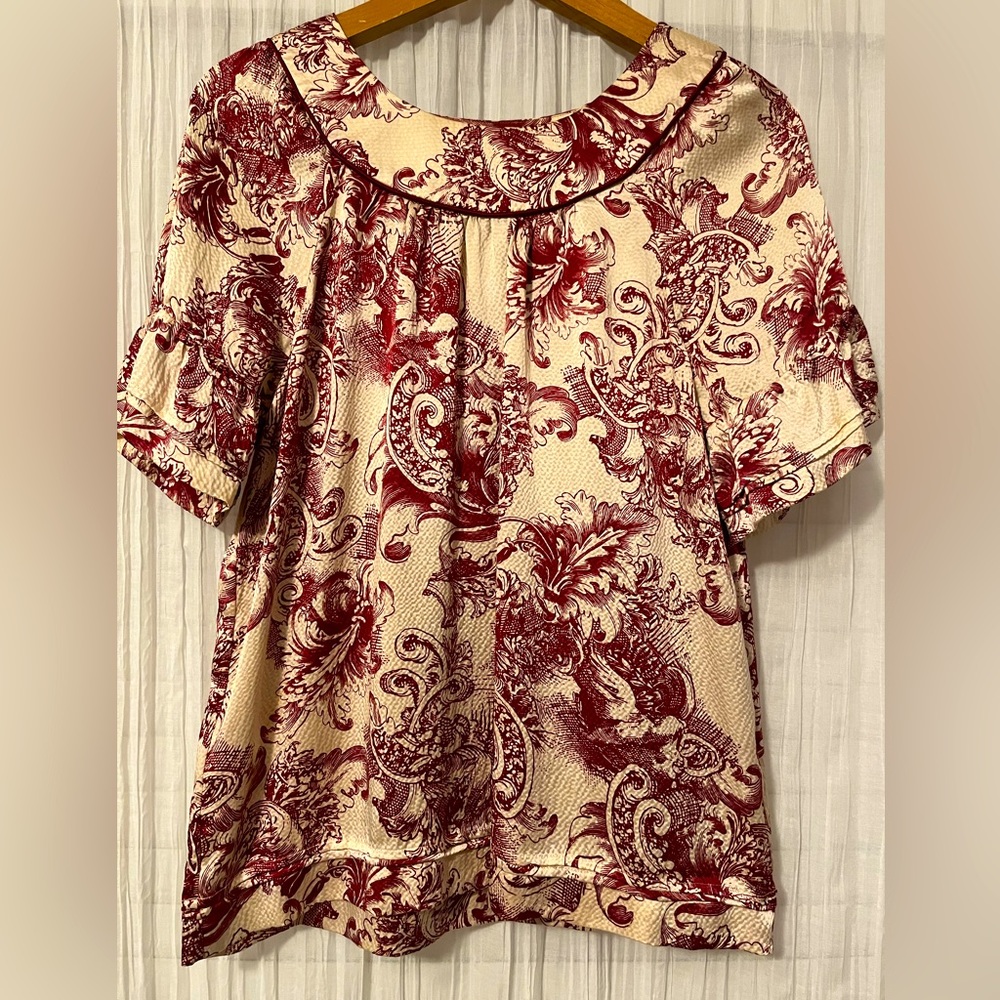 Gorgeous BCBG textured silk blouse with abstract antique floral print.